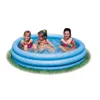 Three young girls are playing in a blue inflatable pool on a patch of grass. Náhled obrázku produktu
