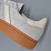 A close-up view of an Adidas Handball Spezial shoe. Voir les images du produit