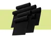 A set of black grill mats arranged in a staggered pile against a white and light green background. Náhled obrázku produktu