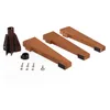 A set of parts for a Christmas tree stand, including wooden legs, a metal base, and hardware, laid out on a white background. Produktbild-Vorschau