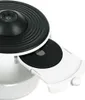 A close-up view of a white and black electronic device with a circular, ribbed top and a tray extended from the side. Anteprima dell’immagine prodotto
