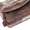 A close-up view of a multi-layered bag with decorative elements and branding. Anteprima dell’immagine prodotto
