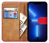 A book-style phone case is open, showing a phone screen, cards, and banknotes. Podgląd zdjęcia produktu