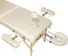 A beige massage table with accessories shown separately. Náhled obrázku produktu