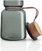 A glass storage jar with a wooden lid and a leather strap. Náhled obrázku produktu