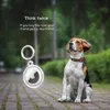 A beagle dog sits next to an Apple AirTag holder on a paved path. Produktbild-Vorschau