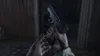 A first-person perspective of someone holding a handgun and inserting a magazine. Produktbild-Vorschau