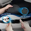 Close-up of hands demonstrating how to attach a car seat cushion using buckles and straps. Produktbild-Vorschau