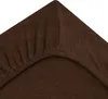 A close-up view of a brown fitted sheet, showing the elasticized corner. Produktbild-Vorschau