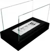 A freestanding bio-fireplace with glass panels and the word 'HOME' etched on the metal insert. Produktbild-Vorschau