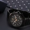 A close-up shot of a black Maserati watch with gold accents, placed on a dark surface next to a patterned fabric. Náhľad obrázku produktu