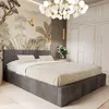 A bedroom scene featuring a bed, wardrobe, and decorative wallpaper.