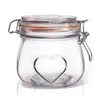 A clear studio shot of a glass jar with a heart design on a white background. Náhled obrázku produktu