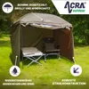 An outdoor shelter set up on a grassy area with a chair and table inside. Produktbild-Vorschau
