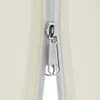 A close-up of a zipper on a beige fabric. Náhľad obrázku produktu