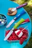A collection of Opinel knives and picnic items laid out on a blue table. Produktbild-Vorschau