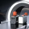 Two power banks are displayed on a reflective surface with a futuristic, metallic background. Produktbild-Vorschau