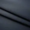 A close-up, folded view of a dark gray fabric. Anteprima dell’immagine prodotto