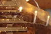 A close-up of LED string lights draped over wooden beams, likely for holiday decoration. Produktbild-Vorschau