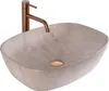 A beige marble vessel sink with a copper faucet and drain. Náhled obrázku produktu