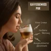 A woman is smelling a cup of coffee. Produktbild-Vorschau
