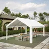 A white party tent set up outdoors with tables and benches set for a meal. Produktbild-Vorschau