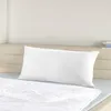 A white pillow on a bed. Produktbild-Vorschau