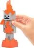 A hand is holding a Minecraft toy figure that is gray with orange flames. Náhled obrázku produktu