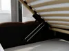 A close-up view of the underside of a bed frame, showing the lifting mechanism and wooden slats. Produktbild-Vorschau