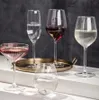 A collection of five wine glasses filled with different beverages, arranged on a white surface with a dark background. Produktbild-Vorschau