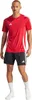 A man wearing a red Adidas soccer jersey and black shorts. Anteprima dell’immagine prodotto