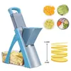 A blue and gray vegetable slicer is shown with various chopped vegetables and sliced fruits displayed in small bowls around it. Sliced potatoes are also shown in a container below the slicer. Voir les images du produit