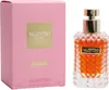 Valentino Donna Acqua Eau de Toilette 50 ml in facettiertem Glasflakon mit goldener Plakette, vor rosa Box mit goldener Beschriftung. Produktbild-Vorschau
