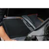 A person is placing a folded dog crate into the trunk of a car. Produktbild-Vorschau