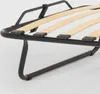 Close-up view of a metal bed frame with wooden slats. Produktbild-Vorschau