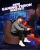 A man is playing a video game while sitting on a large beanbag chair in a dimly lit room. Produktbild-Vorschau