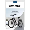 A white electric bicycle is shown in a studio setting with a curved wall in the background. Produktbild-Vorschau
