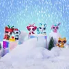 A group of Littlest Pet Shop toys in a snowy, winter-themed setting with falling snow. Podgląd zdjęcia produktu