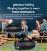 People enjoying an outdoor gathering with a portable speaker. Produktbild-Vorschau