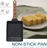 A Japanese omelet pan with a wooden handle, shown next to sliced tamagoyaki on a plate. The background is a green cloth. Náhľad obrázku produktu