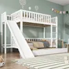 A white bunk bed with a slide and a pull-out trundle bed is set up in a child's room with light green walls and decorative hot air balloons. Produktbild-Vorschau