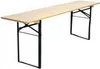 A long, narrow wooden table with black folding legs, shown against a white background. Náhled obrázku produktu