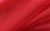 A close-up, abstract view of red fabric, showing folds and texture. Produktbild-Vorschau