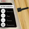 A black door handle set is shown on a wooden door, with a graphic overlay detailing the included components. Produktbild-Vorschau