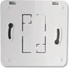 The back of a white electronic device, likely a thermostat or control unit, is shown against a white background. The device has mounting slots and a central recessed area with cutouts. Voir les images du produit