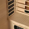 Interior view of a wooden sauna cabin, showing the wooden floor, wall paneling, and heating elements. Produktbild-Vorschau