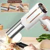 A person is using a handheld electric noodle maker to make spaghetti into a bowl of food. Produktbild-Vorschau