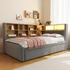 A bedroom scene featuring a bed with a headboard bookshelf and ambient lighting. Produktbild-Vorschau