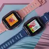 Two children's smartwatches, one pink and one blue, are displayed on a pink and blue background. Náhled obrázku produktu