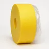 A roll of yellow insulation material, likely for flooring, is shown against a white background. The roll is partially covered by clear plastic packaging. Náhľad obrázku produktu